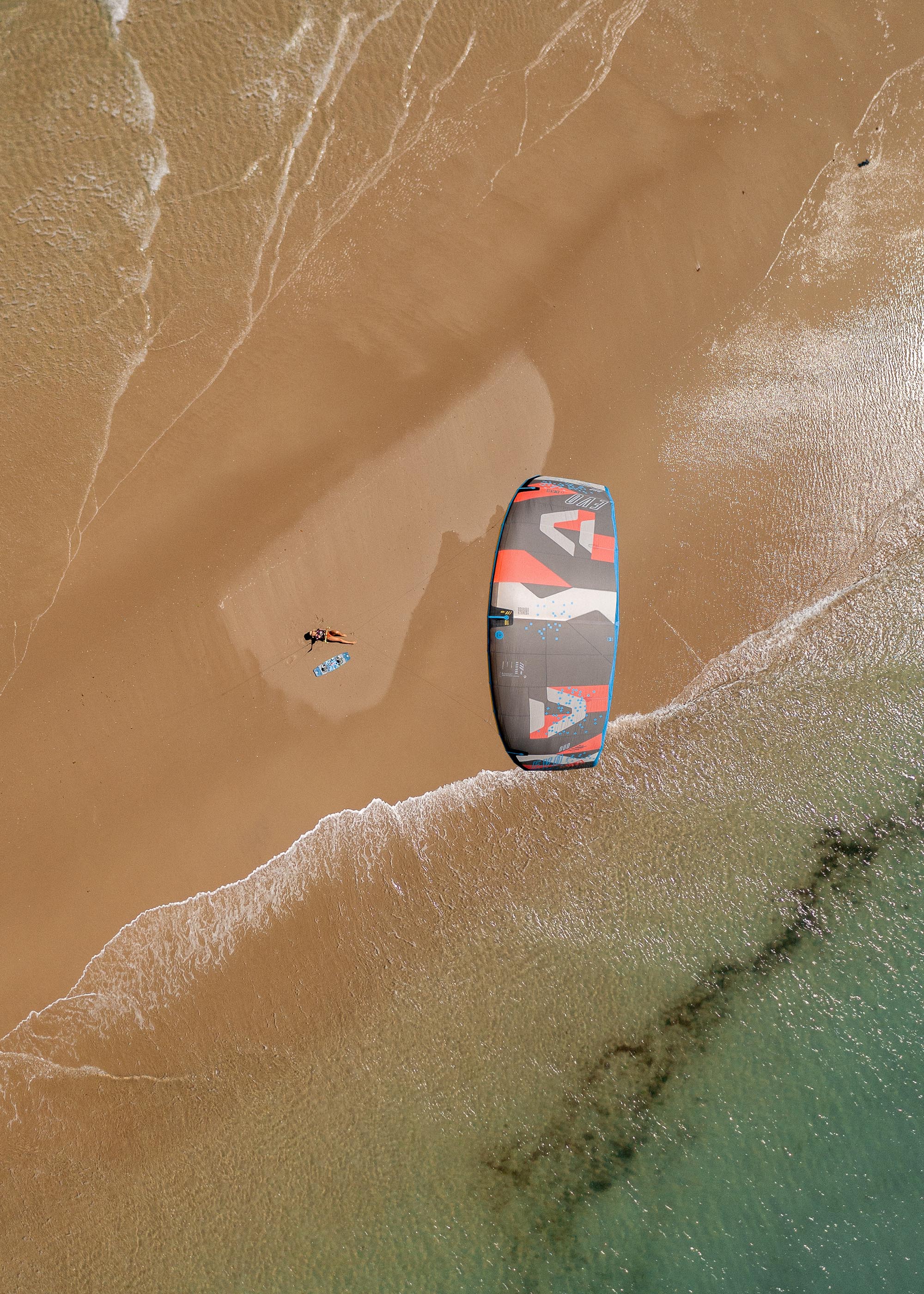 Aerial drone shot of a kite on the beach